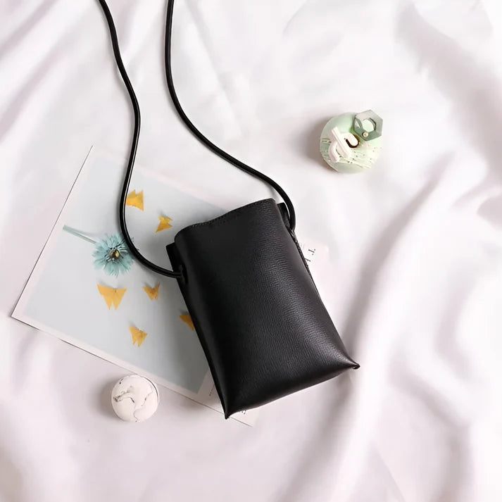 Model wearing Felly Bag – minimalist PU leather shoulder bag with hasp closure and smooth finish, by Vespera The Label
