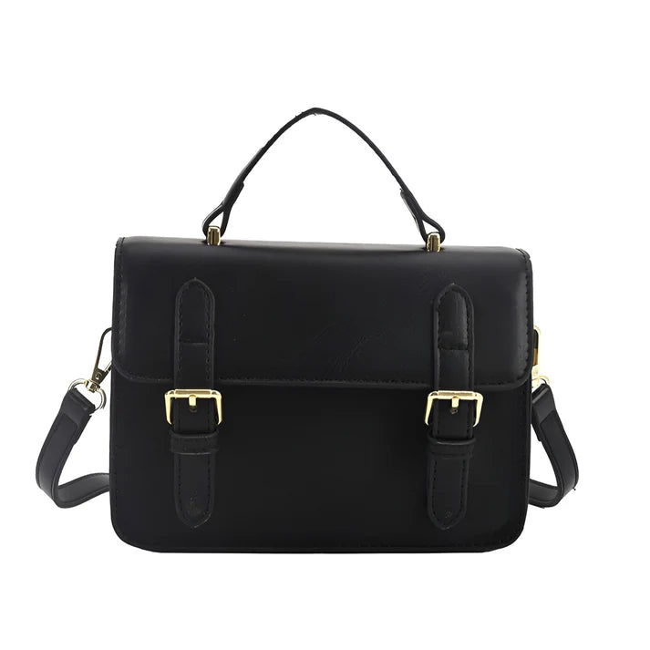 Model holding Ishna Bag – minimalist PU leather clutch with flap pocket and hasp closure in compact structured silhouette by Vespera  The Label