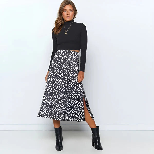 Model wearing Lydie Skirt – printed mid-calf A-line cotton skirt, styled for casual warm weather, by Vespera The Label