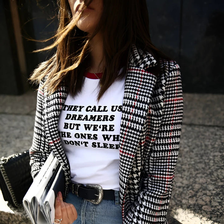 Model wearing Dreamers Top – graphic slogan crop top for women with a fitted cut and bold text print by Vespera The Label.