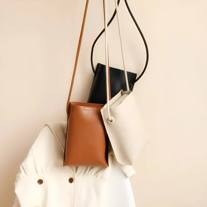 Model wearing Felly Bag – minimalist PU leather shoulder bag with hasp closure and smooth finish, by Vespera The Label