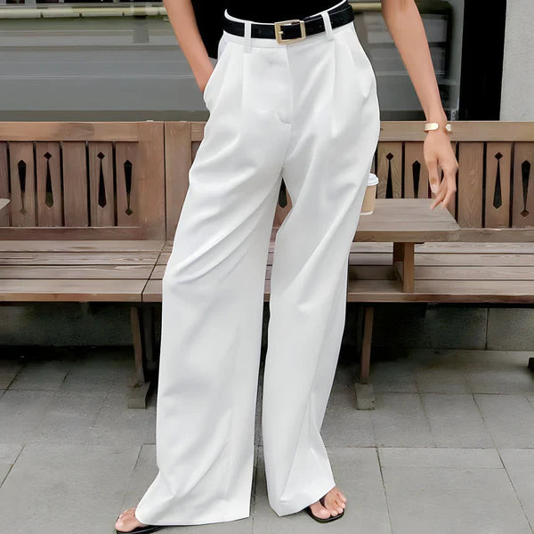 Model wearing Fierra Pants – wide leg ankle-length office trousers in smooth polyester, by Vespera The Label