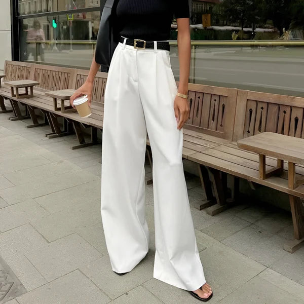 Model wearing Fierra Pants – wide leg ankle-length office trousers in smooth polyester, by Vespera The Label