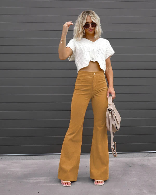 Model wearing Sheena Pants – full-length flare trousers with slim fit and mid-rise cut, styled for winter wear by Vespera The Label