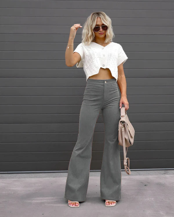 Model wearing Sheena Pants – full-length flare trousers with slim fit and mid-rise cut, styled for winter wear by Vespera The Label