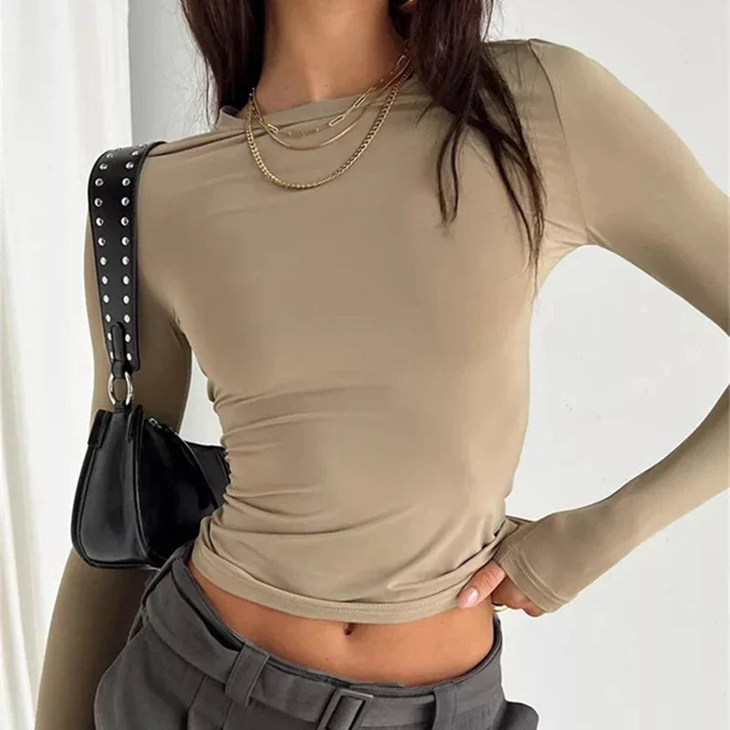 Model wearing Butter Long Sleeve Top – high stretch fitted long sleeve top in sleek, minimalist style by Vespera The Label.