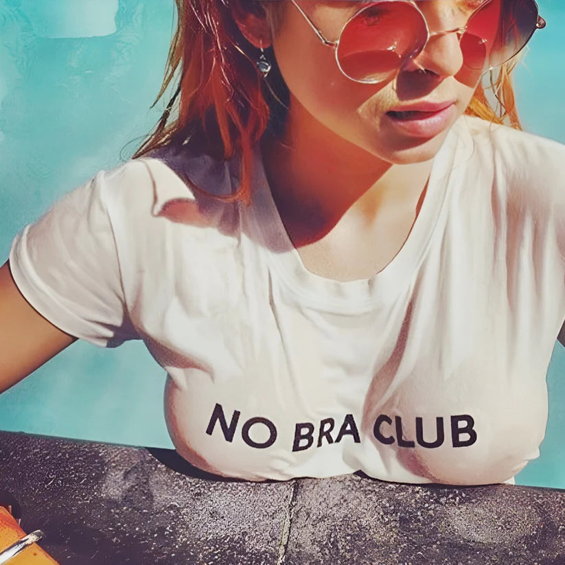 Model wearing No Bra Club Top – bold slogan crop top for women in casual summer styling by Vespera The Label.