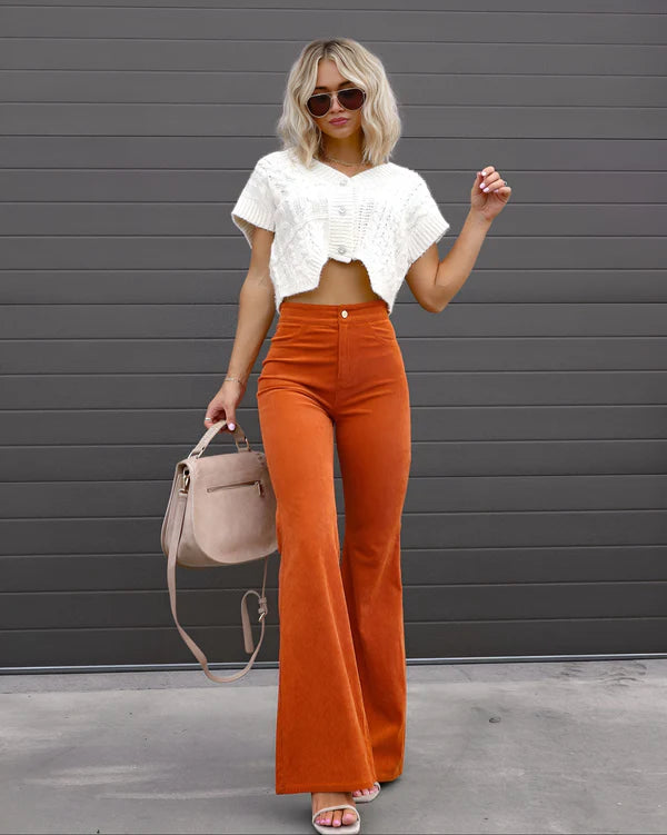 Model wearing Sheena Pants – full-length flare trousers with slim fit and mid-rise cut, styled for winter wear by Vespera The Label