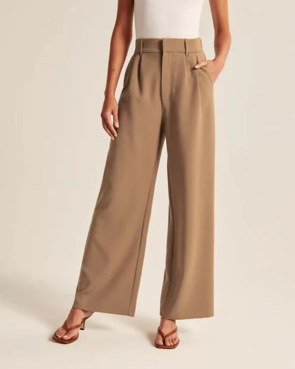 Model wearing Macmillan Pants – casual relaxed-fit trousers for women in minimal design, by Vespera  The Label