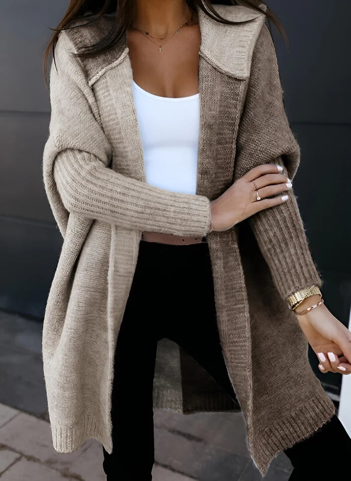 Model wearing Mimi Sweater – long loose-fit women’s patchwork knit sweater for winter, by Vespera The Label