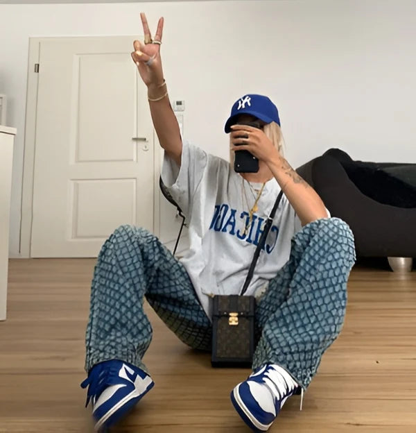 Model wearing Zilla Pants – full-length wide-leg cotton trousers with patchwork plaid detail, by Vespera The Label