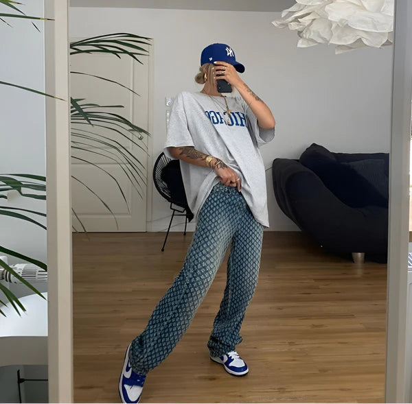 Model wearing Zilla Pants – full-length wide-leg cotton trousers with patchwork plaid detail, by Vespera The Label