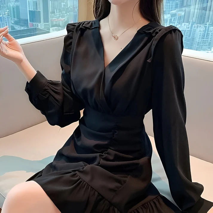 Model wearing Vespera Antares Mini Dress – ruffled fit & flare elegant mini dress for playful occasions by Vespera The Label.