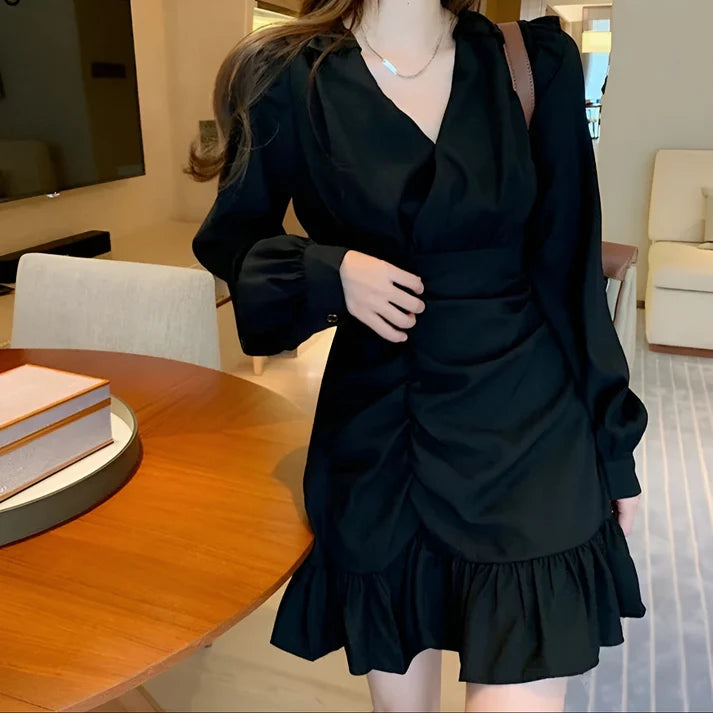 Model wearing Vespera Antares Mini Dress – ruffled fit & flare elegant mini dress for playful occasions by Vespera The Label.