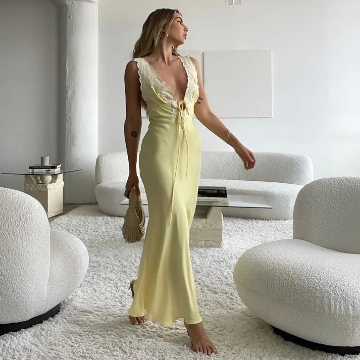 Model wearing Vespera Janus Maxi Dress – slim fit printed summer beach maxi with lace accents by Vespera The Label.