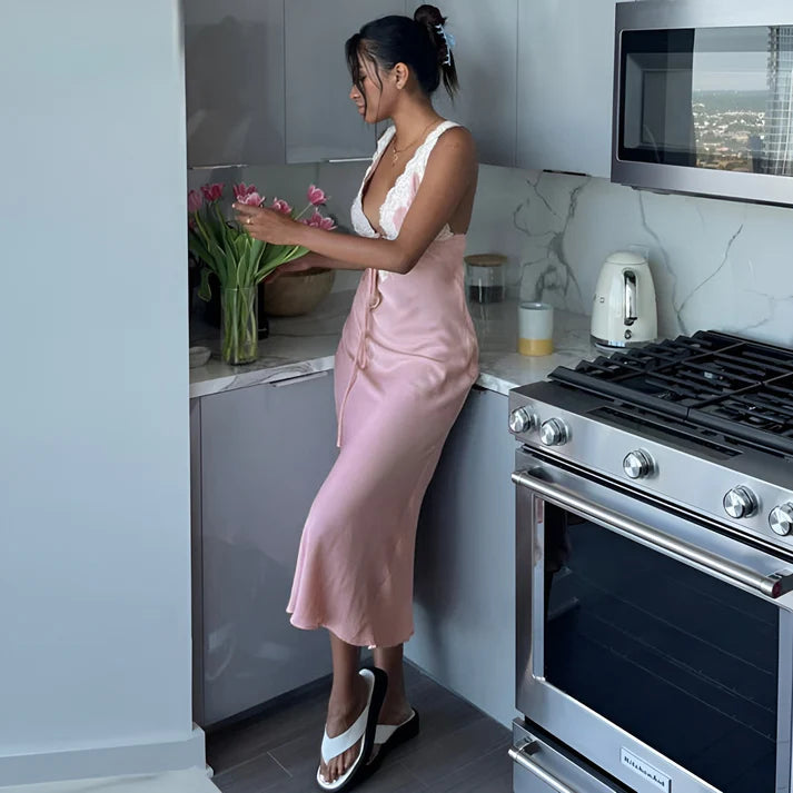 Model wearing Vespera Janus Maxi Dress– slim fit printed summer beach maxi with lace accents by Vespera The Label.