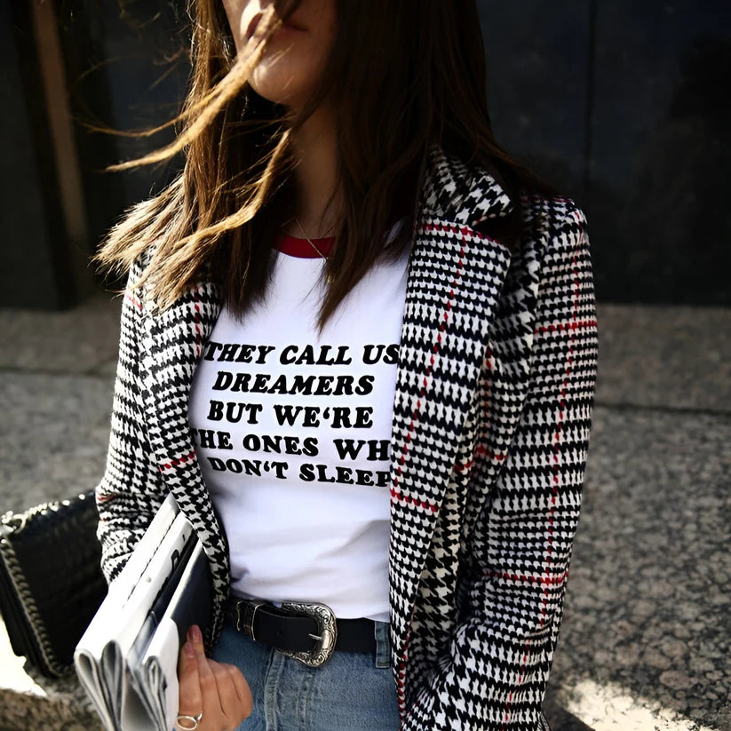 Model wearing Vespera Vara Top – graphic slogan crop top for women with a fitted cut and bold text print by Vespera The Label.