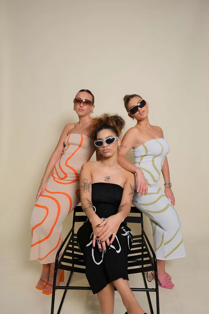 Model wearing Vespera Venus Midi Dress – striped cotton knit bodycon midi with all-season versatility by Vespera The Label.